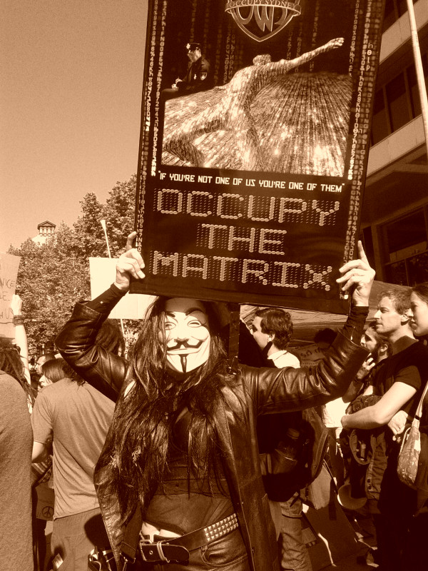 Anonymous turns out at Occupy Sydney with "Occupy the Matrix" banner